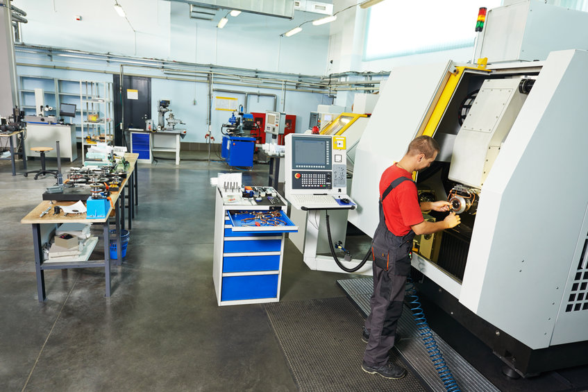 Maintenance worker tending to equipment